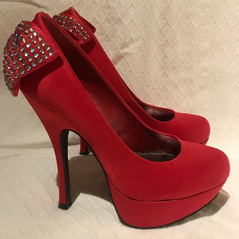 Red, rhinestone studded stilettos pumps